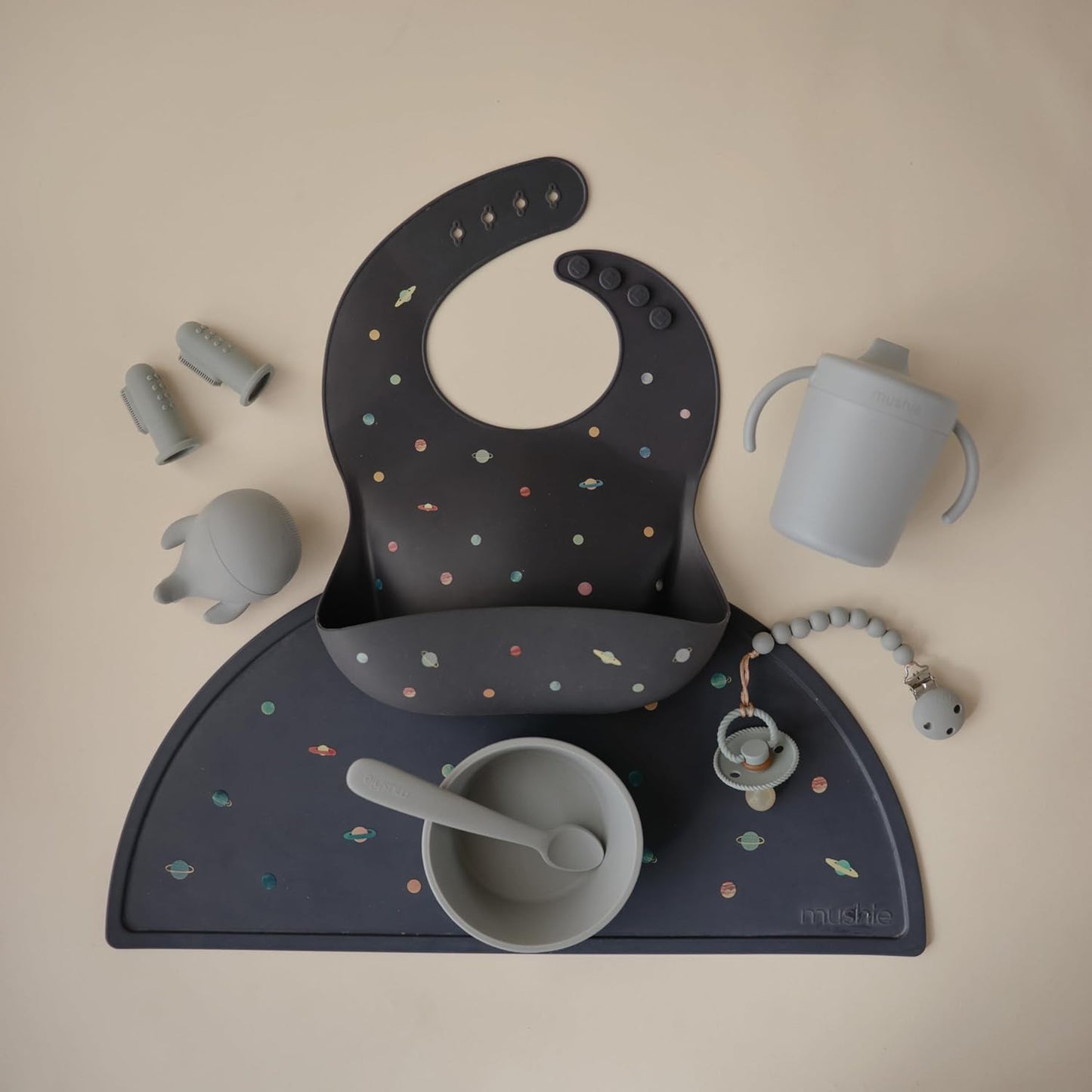 mushie Silicone Baby Bib | Adjustable Fit Waterproof Bibs (Planets)