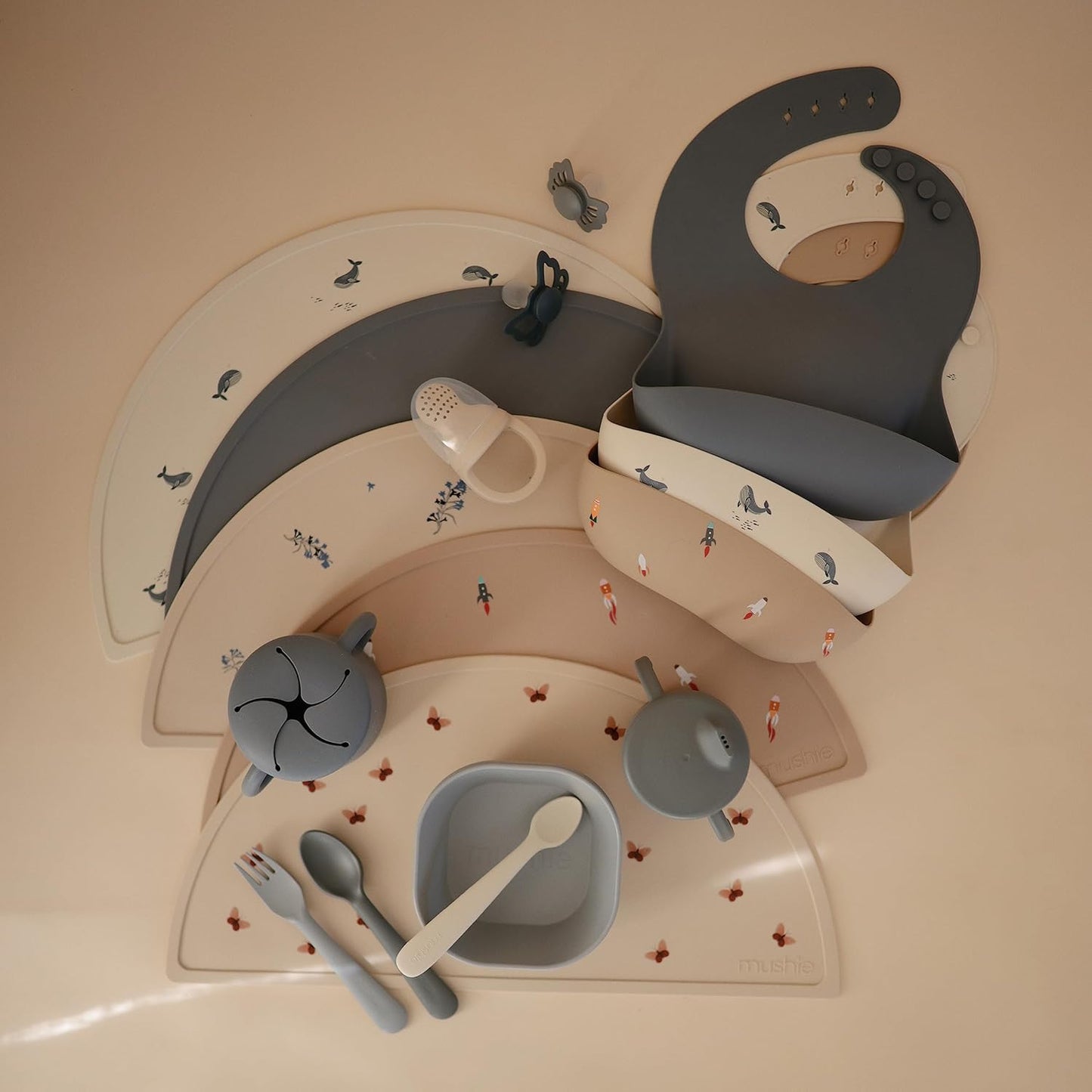 mushie Silicone Baby Bib | Adjustable Fit Waterproof Bibs (Rocket Ship)